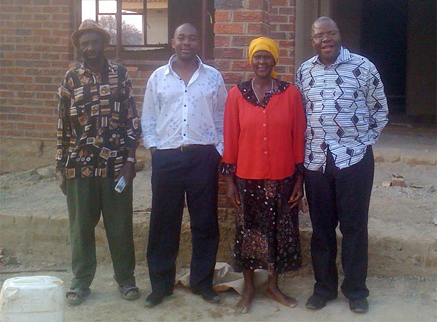 Proud parents ... Nelson Chamisa poses for a photo while flanked by his parents and MDC deputy president Tendai Biti